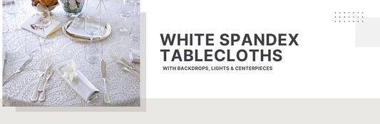 Elegant event table setup featuring a white spandex tablecloth with glassware, cutlery, and floral centerpieces for a modern celebration